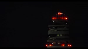 Airport tower at night overseeing takeoff