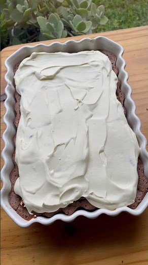 Brownie cake with dulce de leche and cream