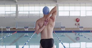 Swimmer stretching at swimming pool