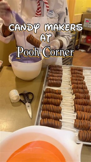 Foodatdisneyland on Instagram: "Always a treat watching the Disneyland Candy Makers in action! Pooh Corner is reopened and serving up both seasonal treats and classic treats like their Tigger Tails and updated Hunny Apple. #disneyland #disneylandfood #poohcorner #foodatdisneyland #disney"