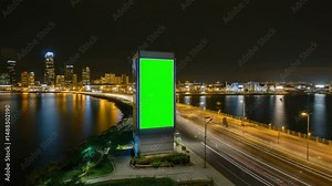 Night cityscape, light trails on a bridge, vertical green screen. Perfect for urban development promos, VFX, and modern city backdrops.