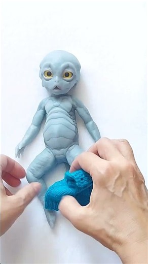 Can This Alien Baby’s Long Tail Fit Inside Tiny Overalls? 💙