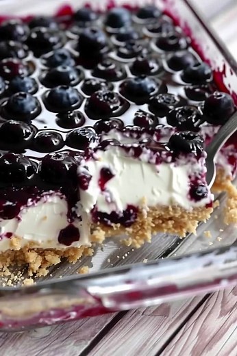 These Keto Blueberry Cheesecake Bars are the creamy, dreamy, low-carb dessert you didn't know you were missing. 🫐✨ Zero guilt, 100% delicious. Watch until the end for the perfect slice! ​Hashtags: #KetoCheesecake #LowCarbDessert #KetoBars #BlueberryCheesecake #SugarFreeSweets #KetoRecipes #DessertReels | Yummy Recipes