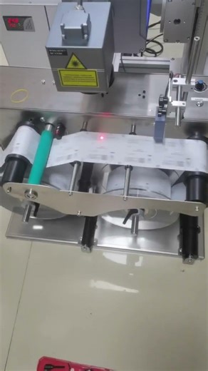 Phezer PL3 UV laser printer paired with rewinder for label printing