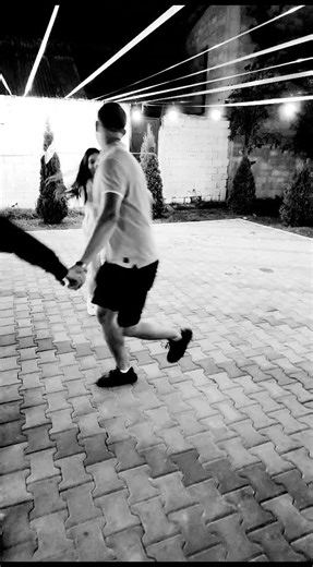 Outdoor Group Dance Activity Under String Lights