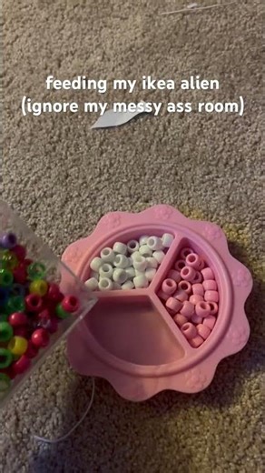 feeding my ikea alien my pony beads (what am i doing with my life) #ikeaalien #ieatkids
