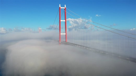 Watch fog transform world's longest suspension bridge