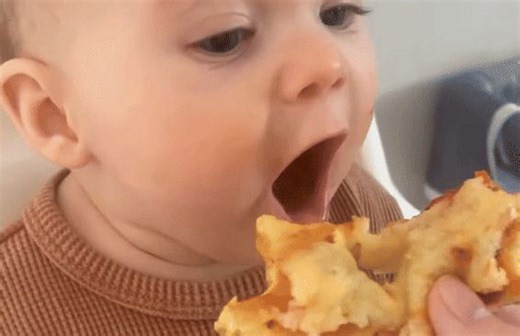 Baby Is Instant Fan After Trying Pizza for First Time