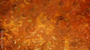 Preparation of stewed octopus with tomatoes, typical Italian recipe called stewed octopus, octopus stew, Luciana-style octopus.