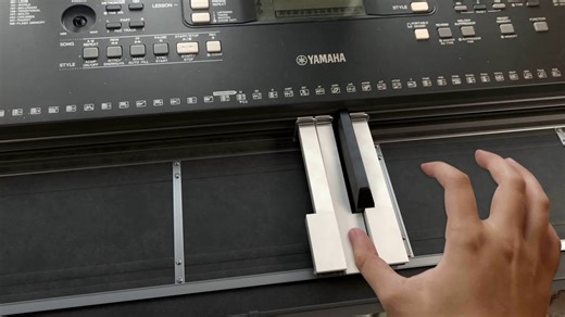 An Inventive Musical Keyboard With Four Sliding Keys That Automatically Move to the Next Note