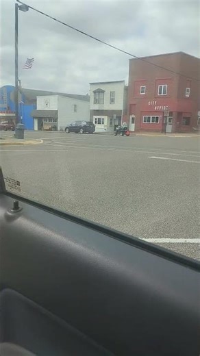 Old Dude Riding Lawn Mower Down Main Street 4-18-26.