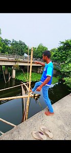Fishing is being done with a net under the bridge. | Fast Review
