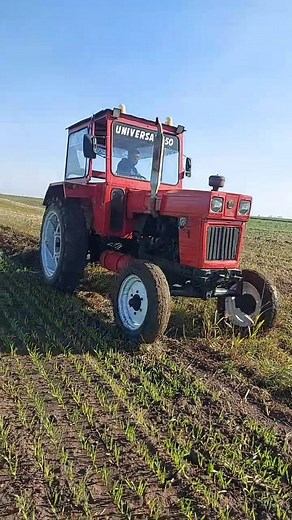 UNIVERSAL 650 Tractor Plowing a Field