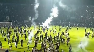 Indonesia’s top football league suspended after deadly crowd crush