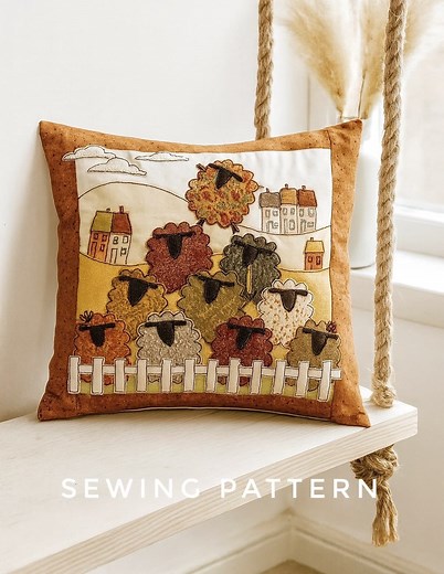 A little flock of cuteness 🐑🐑🐑 My Counting Sheep appliqué cushion pattern is perfect for adding a touch of charm to your home. With layered fabrics, free-motion embroidery and a sweet picket fence, it’s a joy to stitch — and a lovely project for any season! Full templates & step-by-step instructions included Ideal for beginners & improvers #HelenNewtonSews #CountingSheep #AppliquePattern #FreemotionEmbroidery #SewingProject #sheep #PatchworkCushion | Helen Newton Sews