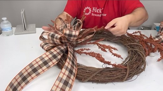 Nick's Seasonal Décor… DIY Fall Wreath with Nick Kreticos… Join designer Nick from Nick's Seasonal Decor as he guides you through creating a stunning fall-themed wreath. In this tutorial, you'll discover how to effortlessly make a beautiful wreath adorned with autumn-inspired elements using the Bowdabra. Fall-themed wreaths are a delightful addition to any front door, adding a vibrant burst of colors and a touch of charm to your home. If you've always wanted to craft your own wreath with an ench
