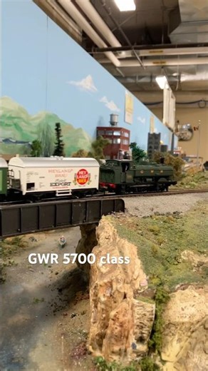 Great Western 5700 class Pannier tank engine hauling a beer train over a bridge