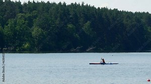 Canoeing championship training coaching workout a outrigger canoe boat sport. Single rowing female in large water