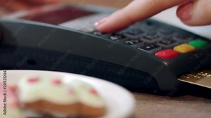 Woman hand enter pin code on payment terminal. Credit card payment for order in cafe. Banking services of electronic money. Credit card machine for money transaction. Close up of female hand enter pin