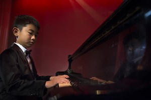 This 9-year-old piano prodigy who goes to school at Camp Foster on Okinawa has already wowed an audience at New York’s Carnegie Hall, despite spending only two years seriously studying the instrument: https://www.stripes.com/news/dodea-piano-prodigy-goes-from-third-grade-to-carnegie-hall-with-a-little-help-from-youtube-1.587809 Produced by Carlos M. Vazquez II/Stars and Stripes | Stars and Stripes
