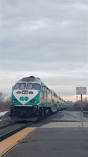 GO Train Beats a CN Freight Train into Ajax GO. #canadiantrains #gotransit #cnrailway