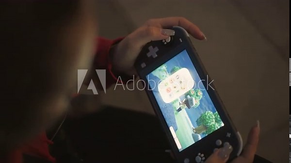Handheld Device Tutorial Session, Player Practicing Level Progress Through Thumb Input On Handheld Console, Focus On Soft Evening Lighting As User Navigates Game Menus And Tutorials Using Thumb