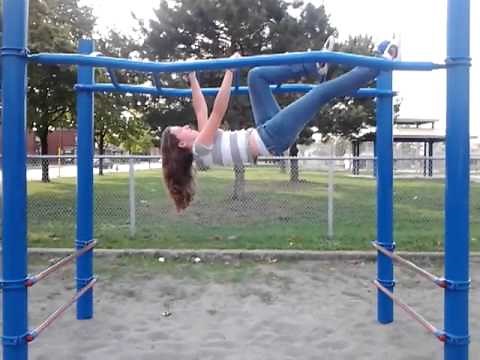 Alexis on the monkey bars at farfeield park