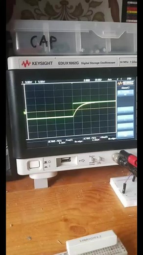 By just connecting a capacitor and a resistor to a power supply, and by using an oscilloscope we can visualize how the capacitor charges. It starts from 0V to the voltage supplied by the PSU. The curve is exponential flowing the function shown in the the third picture. Time of the charging is the time needed for the capacitor to reach 93% of Vmax. Follow this account so you can enjoy and learn electronics. #electronics #embeddedsystems #signal #studying #experimenting #thenerd