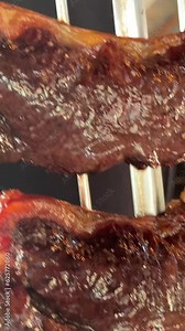 Natural traditional barbecue on the grill on the street, meat fried over the fire. A man is preparing a barbecue on a skewer, delicious and appetizing hot meat. High quality 4k footage