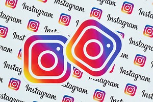 Download Instagram pattern printed on paper with small instagram logos and inscriptions. Instagram is American photo and video-sharing social networking service owned by Facebook