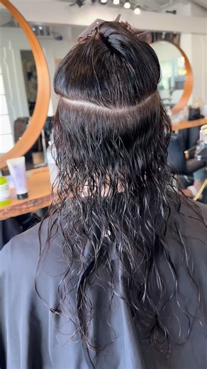 Orange County Hair Extensions by Hailey on Instagram: "Custom curls = seamless blend every time ✨ Installed these custom permed Genius Wefts from Christian Michael Hair Extensions in the shades Hazelnut and Going to the Dark Side to perfectly match my client’s natural curl pattern 🤎 Because extensions should belong in the hair, not sit on top of it. I hand-permed these wefts myself to mirror her natural texture, giving her effortless volume, length, and movement while keeping everything soft, l