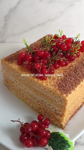 No-Bake, Dulce de Leche Waffle Cake 🍰❤️ (A version of Ukranian Kyiv Cake) This is a beloved Eastern European dessert experience that I tried this year and wanted to share with all of you ☺️ At the heart is Dulce de Leche, a sweet caramel sauce from milk that is infused in each layer of the Waffle cake 🧇 creating a yummy combination from both Latin American and European Cuisines This is a popular dessert in Ukraine, where the wafer cake is a symbol of Ukrainian culinary heritage. It is also cal