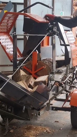 Splitting rounds in the log processor! #woodprocessor #firewood #splitter #shortsviral #shorts