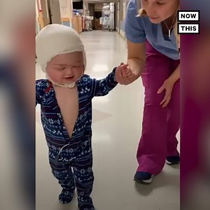 Watch this baby take his first steps after recovering from surgery for a rare brain condition | NowThis