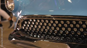 This video shows a panning of a light blue and chrome kustom 1950s Buick car grill.