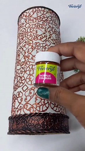 Turn an ordinary canister into an extraordinary flower holder! Make this DIY using Fevicryl Acrylic Colours to give a fresh look to your flower display. Drop a flower emoji that you would like to place in this DIY. Follow the steps below for this DIY - Prepare the canister; take a bottle canister and paint it with a base coat of Fevicryl Acrylic Colour white 27. Let it dry. - Trace and outline the design; draw and trace your desired ornamental design on the canister. Paint the outline using Fevi