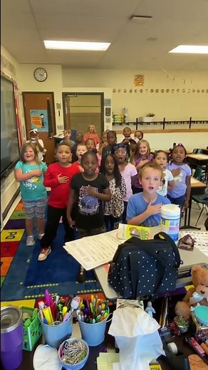 Mrs. Cozzolino’s class saying the Pledge of allegiance￼