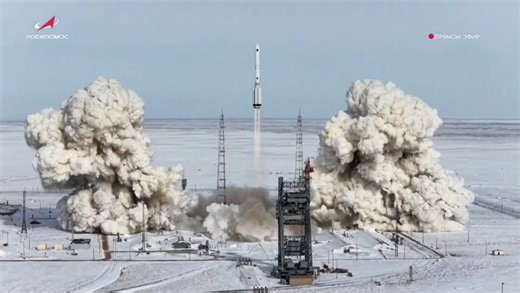 Russian Proton rocket launches weather satellite from snow covered Kazakhstan