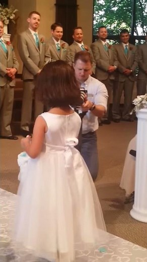 Flower girl (Raha)walking down the aisle