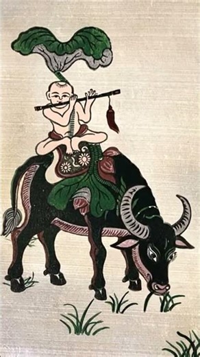 The boy plays the flute and rides the buffalo 1