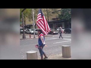 Oregon standoff defendant supporters wave flags near the courthouse