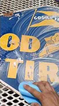 cleaning a porcelain sign