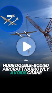 Large twin fuselage aircraft avoids crane during flight