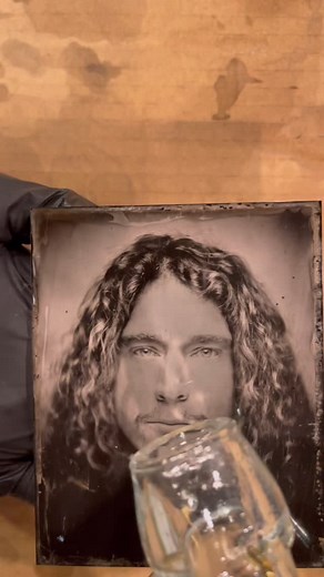 Having my tin type portrait made by @tintype_nj. He slayed the house down boots. Also, not me in my Ken Burns era 💅 If you are curious about the specific steps to making a tin type photograph, below is the step by step guide to how to do it. 1. Phil coats the plate with collodion (a syrupy solution) that contains salts. 2. He dips that plate in a silver nitrate bath, which reacts with the salts to make the surface light-sensitive. 3. When light hits the plate inside the camera, it changes the s