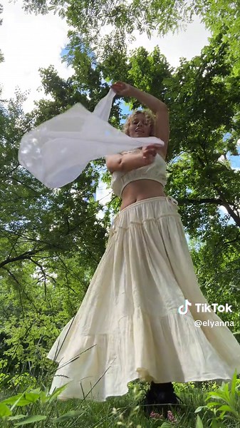 Serene Outdoor Drape Photography in Elegant Cream Dress