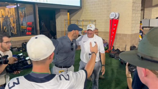 WVU athletic director Wren Baker and WVU head football coach Rich Rodriguez share a moment following the Mountaineers 31-24 victory over the Pitt Panthers! #WVU | HD Media Sports