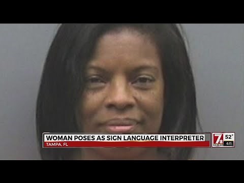 Woman poses as sign language interpreter