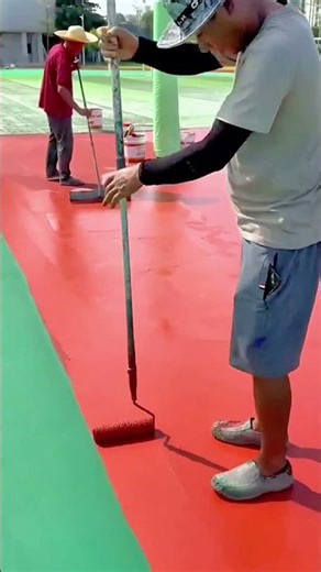 Applying Smooth Outdoor Court Coating with Precision Using a Long Handle Roller Tool