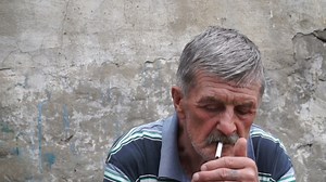 Old Man Smoking a Cigarette