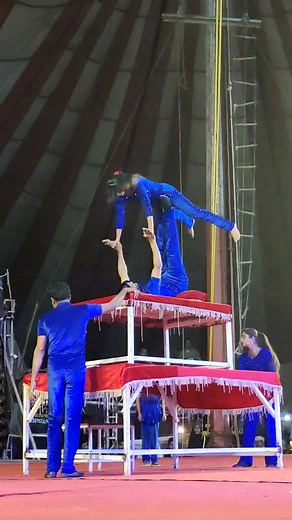 Acrobatic Duo Performance on Colorful Platform